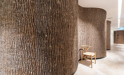 Massive natural Bark House® poplar bark around a curve as part of the Anima Mentis, Vienna health concept, by Freund GmbH